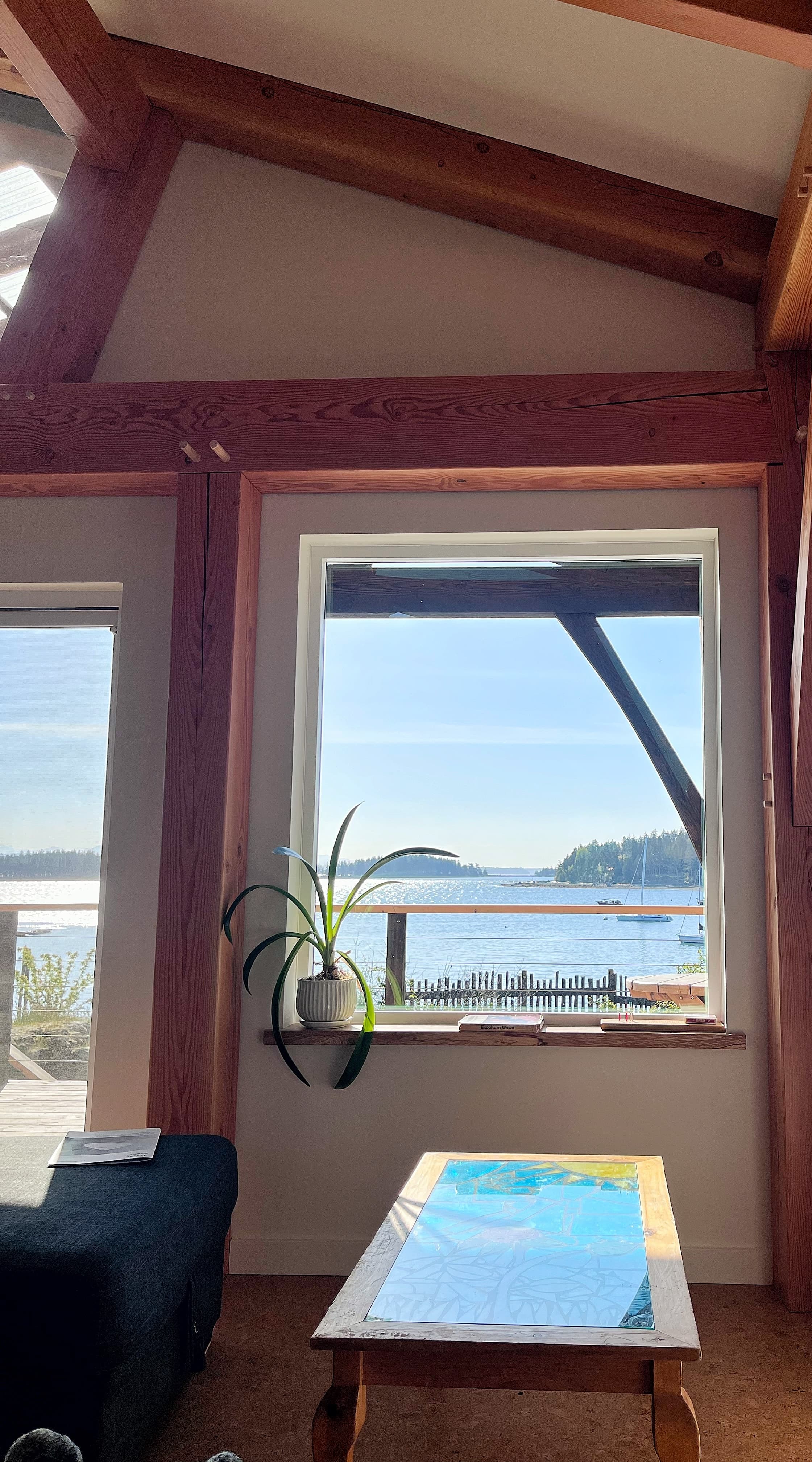 Windows framed by posts and braces, looking out to the islands