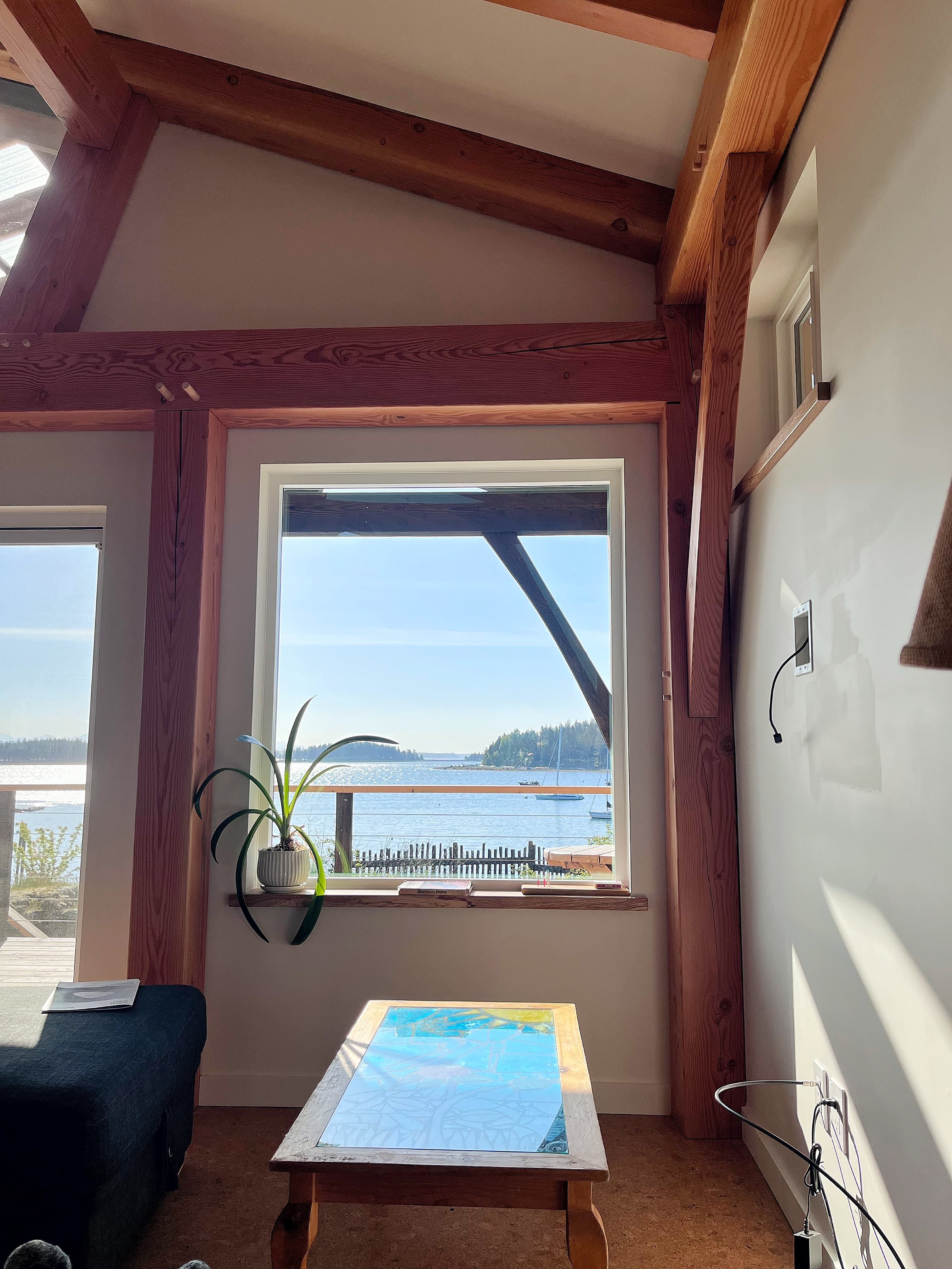 Structural timber work set against sky