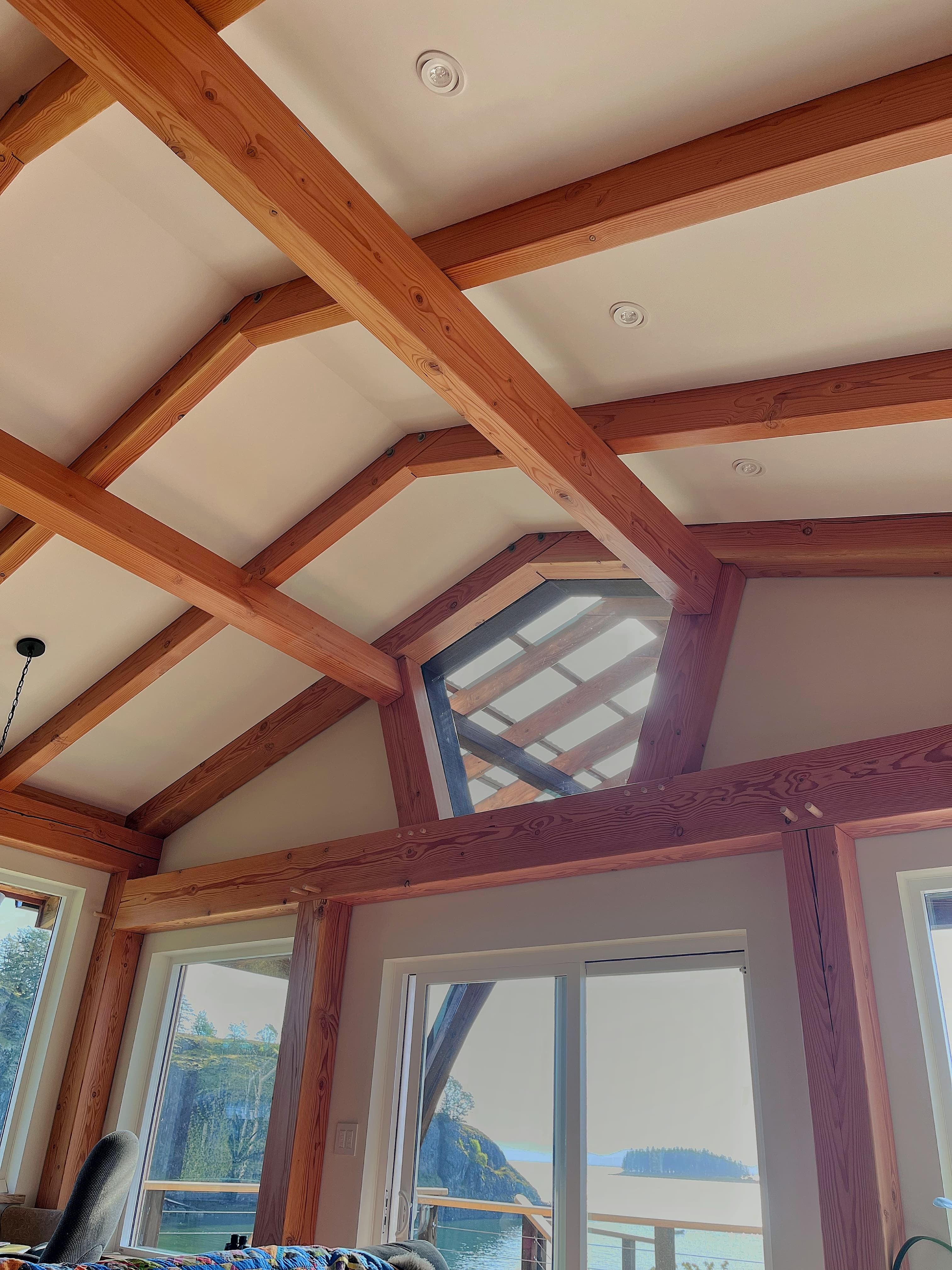 Broad timber frame structure in landscape